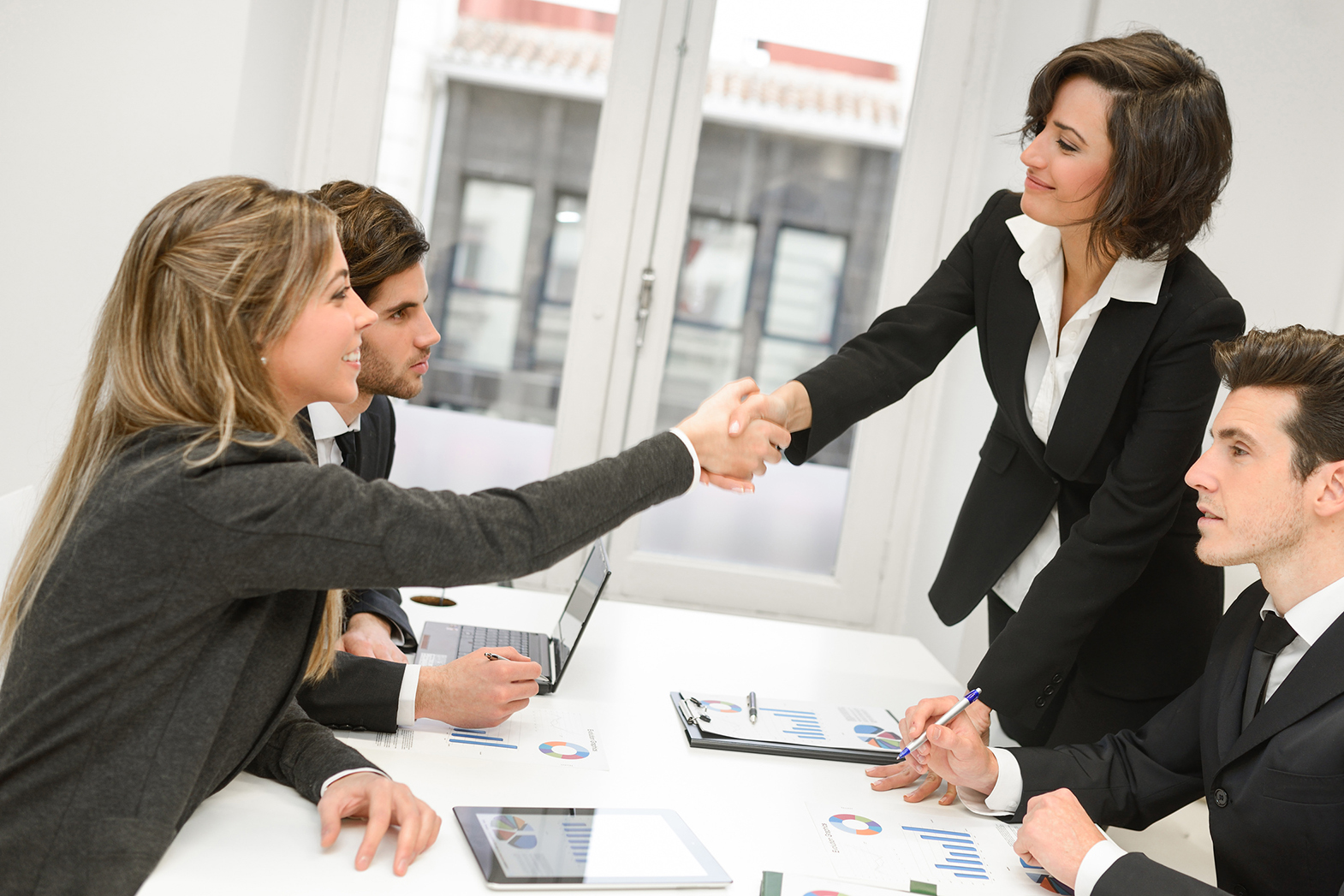 Business people shaking hands, finishing up a meeting